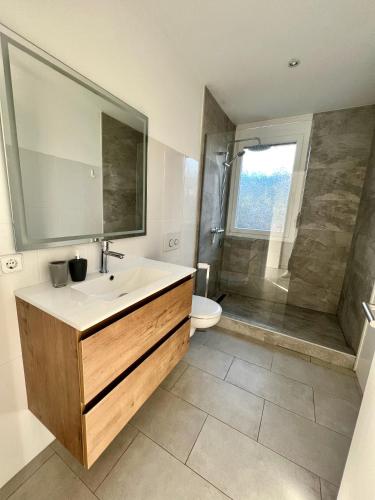 a bathroom with a sink and a shower at CASA Luz Solar - Finca mit privatem Pool nahe Strand & Santanyí in Cala Santanyi
