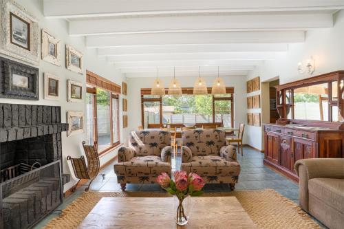 a living room with a couch and a fireplace at Avemore Sedgefield in Sedgefield