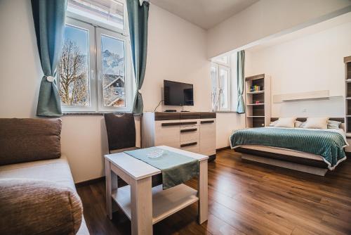 Postel nebo postele na pokoji v ubytování Studio CENTER