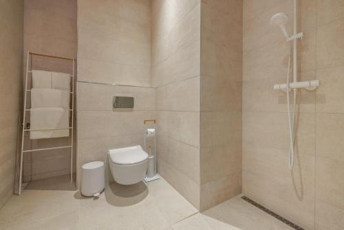 a bathroom with a toilet and a shower at Valli Residence in Tartu