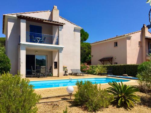 an image of a villa with a swimming pool at Holiday Home Le Mas d'Esquières 7 by Interhome in Les Issambres