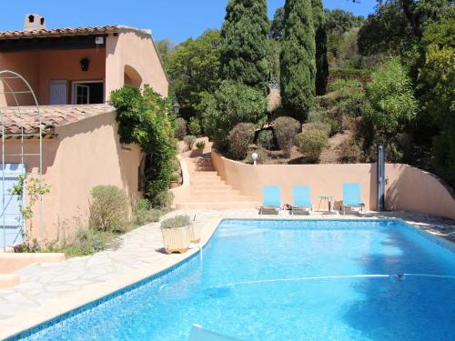 a swimming pool in front of a house at Villa Mare E Sole by Interhome in Cavalaire-sur-Mer
