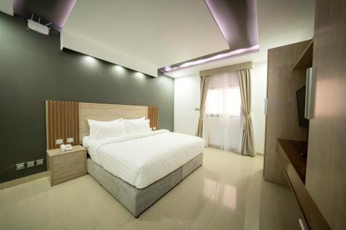 Mirada Gold Jizan - Resort & Private Pools tesisinde bir odada yatak veya yataklar