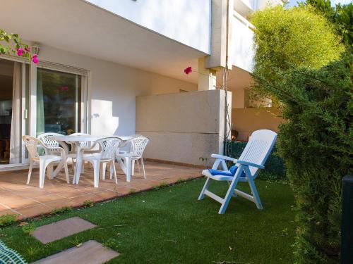 a group of chairs and tables on a patio at Holiday Home Jardines Del Saladar by Interhome in Jávea