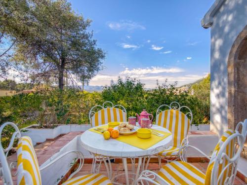 a table and chairs on a patio at Holiday Home Masirope by Interhome in Jávea