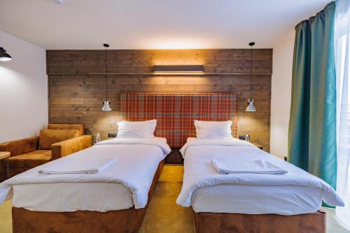 Ένα ή περισσότερα κρεβάτια σε δωμάτιο στο Iglika Hotel & Villas Borovets