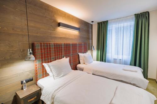 Ένα ή περισσότερα κρεβάτια σε δωμάτιο στο Iglika Hotel & Villas Borovets
