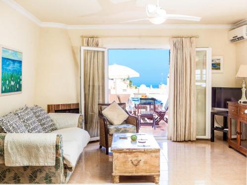 a living room with a couch and a table at Holiday Home Tejon by Interhome in Nerja