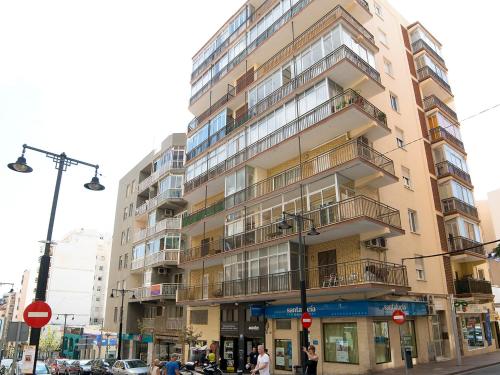 a tall building on a city street with people standing outside at Apartment Gabriel by Interhome in Calpe