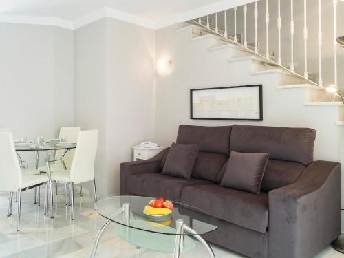 a living room with a couch and a table at Apartment Reserva de Marbella by Interhome in Marbella