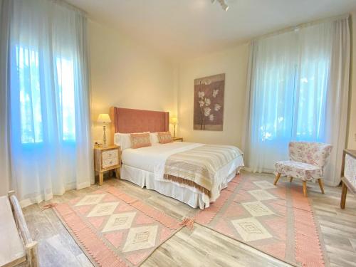 A bed or beds in a room at iloftmalaga Plaza Marina