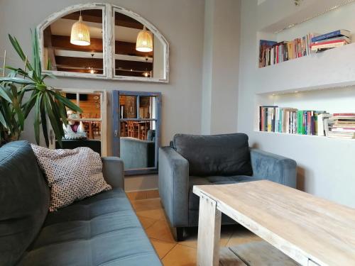 a living room with a couch and a table at Karczma Karnasów in Cisna