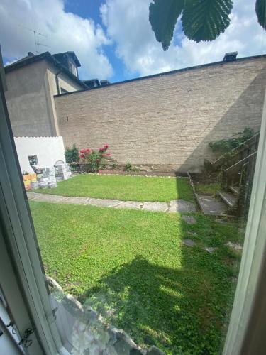 a view of a yard from a window at Hotell Villa Borgen in Visby