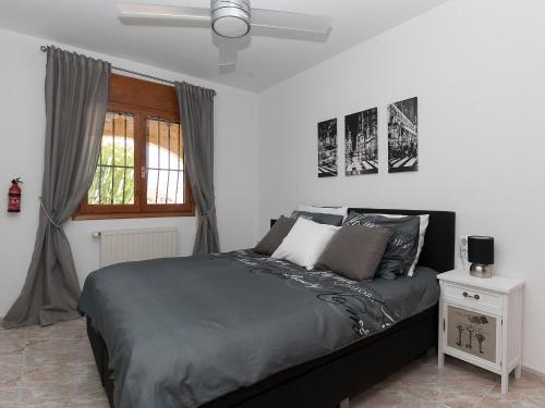 A bed or beds in a room at Villa Buena Gente by Interhome