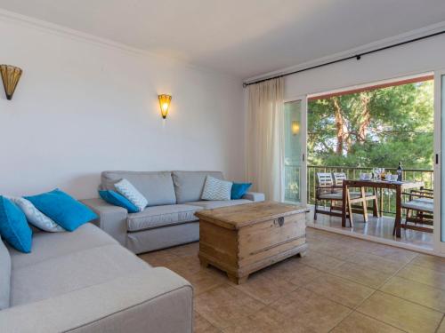 a living room with a couch and a table at Apartment Sorts de la Mar-1 by Interhome in Denia