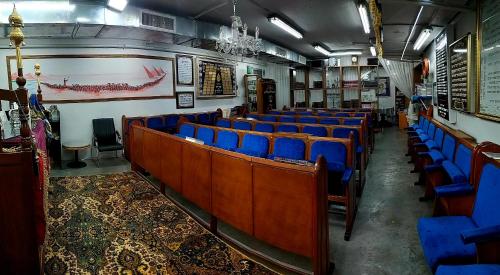 a row of chairs in a room with blue seats at Hotel Apartment Short Term Tel Aviv Bat Yam 5 in Bat Yam