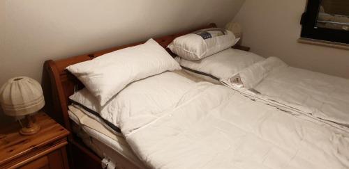 Postel nebo postele na pokoji v ubytování Ladwig - Ferienhaus Adda