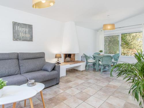 a living room with a couch and a table at Holiday Home Mimosa by Interhome in Cadaqués
