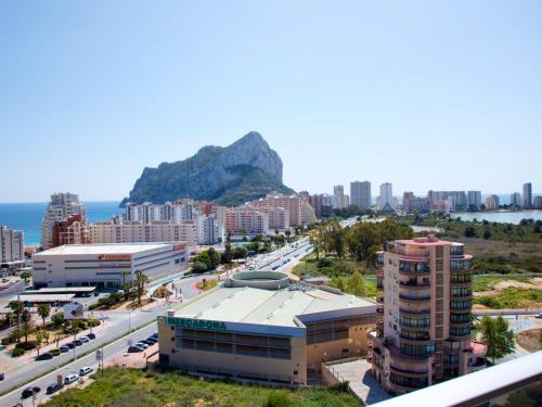 a view of a city with a mountain in the background at Apartment Costa Calpe by Interhome in Calpe
