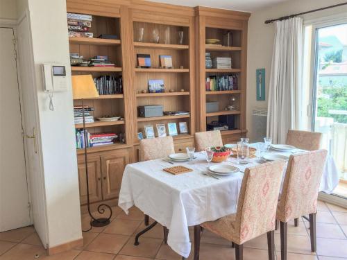 a dining room with a table and chairs at Apartment Le Panoramic by Interhome in Sainte-Maxime