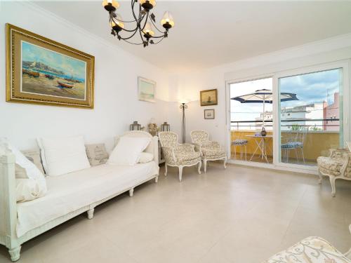 a living room with a white couch and chairs at Apartment Nova Soberana by Interhome in Jávea