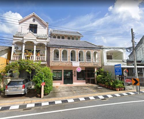 a building with a car parked in front of it at Baan Malee in Phuket