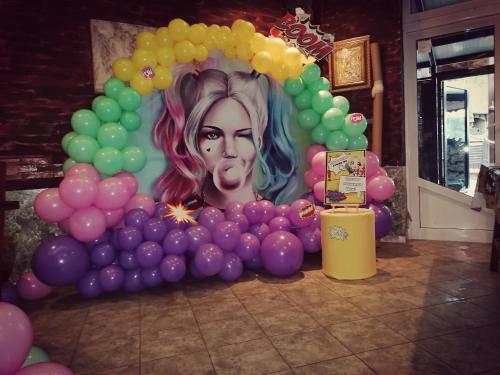 a bunch of balloons with a picture of a woman at Discret Hotel & Restaurant in Vladaya