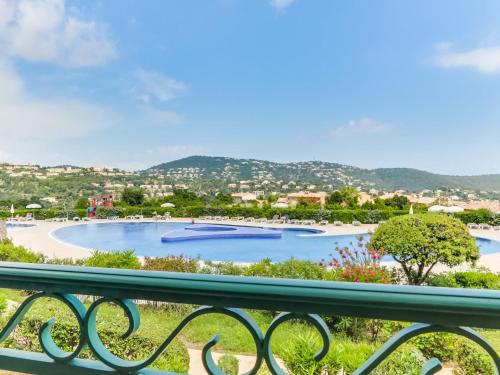 a view of a swimming pool from a balcony at Apartment Le Hameau des Issambres-5 by Interhome in Les Issambres