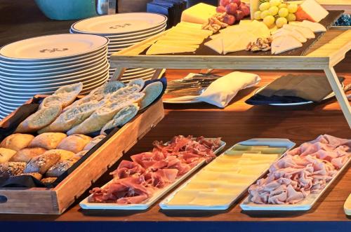 a buffet with many different types of food on a table at chic&basic Habana Hoose in Barcelona