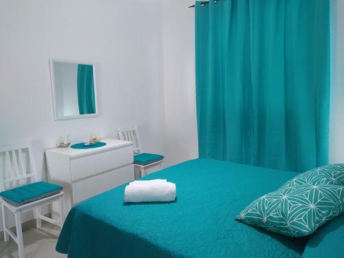 Postel nebo postele na pokoji v ubytování Casa vacanze Oasis Home PortoPino