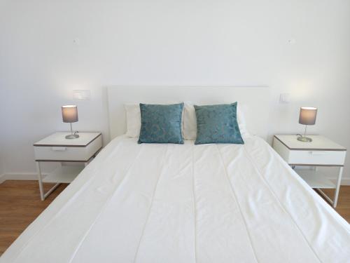 Postelja oz. postelje v sobi nastanitve T3 Alto Forte -Vista Mar,Ar Condicionado,Garagem