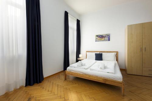 Postel nebo postele na pokoji v ubytování GuestHouse Lugano Studio Apartments by LR