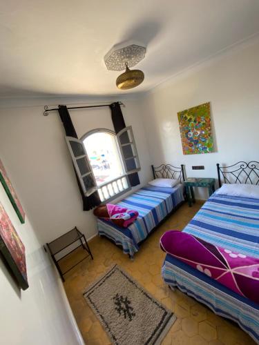 Posteľ alebo postele v izbe v ubytovaní Essaouira Beach Hostel