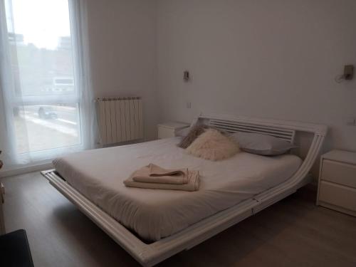 מיטה או מיטות בחדר ב-Plena naturaleza en Pleno San Sebastián
