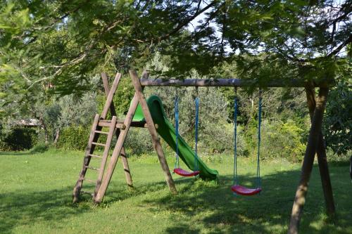 a playground with a slide and a ladder at Borgo Di Collelungo in Montaione