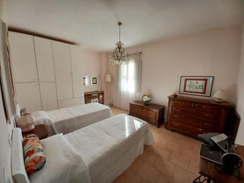 Кровать или кровати в номере Casa Vacanze L'Acquerello