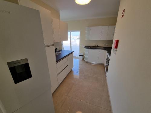 Apartamento com grandes terraços em frente a Praia