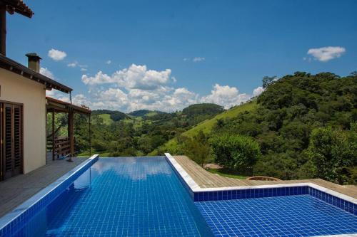Photo de la galerie de l'établissement Casarão com piscina e cachoeira CUNHA SP, à Cunha