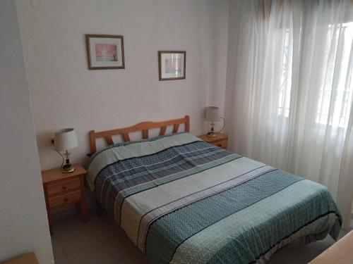 A bed or beds in a room at Apartment Laguna