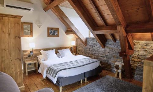 Кровать или кровати в номере Le Moulin de Lily