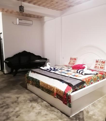 Postel nebo postele na pokoji v ubytování Hotel Sigiriya Kele