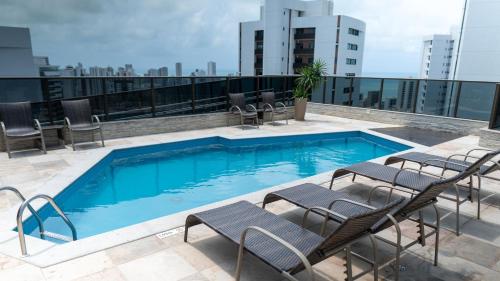 a swimming pool on the roof of a building at Transamerica Fit Recife in Recife