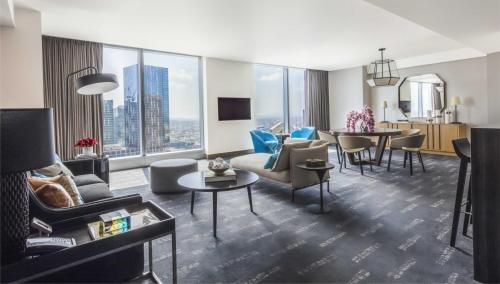 a living room with a view of a city at InterContinental - Los Angeles Downtown, an IHG Hotel in Los Angeles