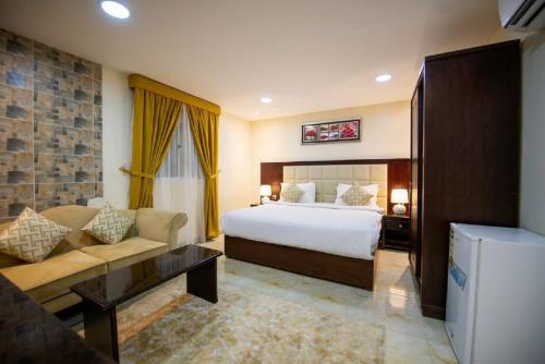 ركن مدهال للوحدات السكنية المفروشة tesisinde bir odada yatak veya yataklar