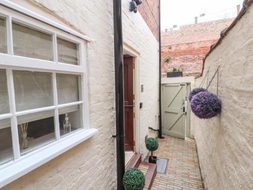a brick building with a door and a window at 12 Deva Terrace in Chester