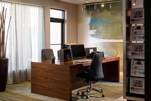 an office with a desk with a computer on it at Sonesta Select Boca Raton Town Center in Boca Raton