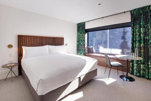 A bed or beds in a room at Crystalbrook Albion