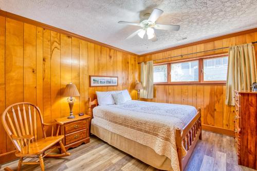 a bedroom with a bed and a ceiling fan at Morris Villa in Lake Junaluska