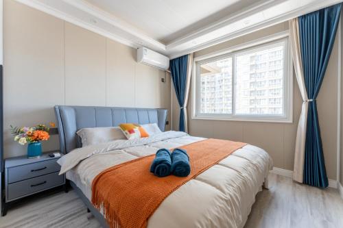 Ένα ή περισσότερα κρεβάτια σε δωμάτιο στο Locals Apartment Inn 12