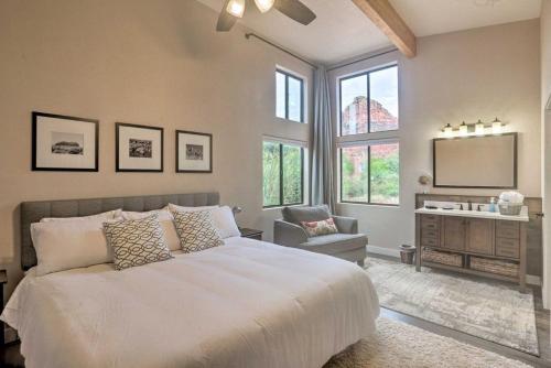 a bedroom with a large bed and a tv at Beautiful Sedona Home Near Chapel of the Holy Cross in Sedona
